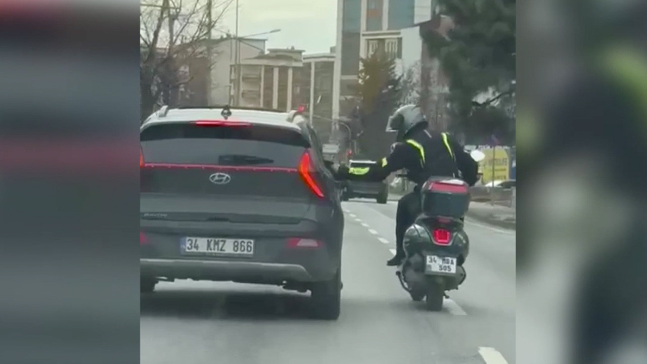 Eliyle otomobilin aynasını kıran motosiklet sürücüsüne ceza