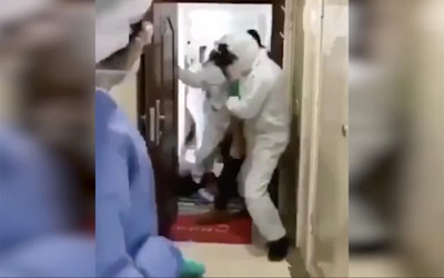 Çin'de koronavirüs şüphesi ile insanlar karantina bölgelerine zorla taşınıyor