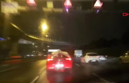 Doludan korumak için aracının üstünde örtü ile dolaştı