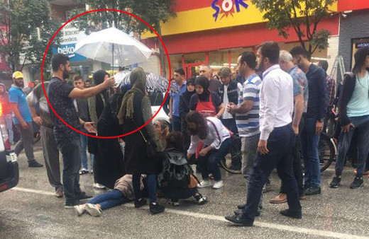 Kaza geçiren genç kıza şemsiyeli koruma