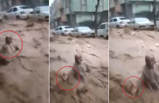 Tepki çeken görüntüler: Sele kapılan adam elini uzattı, tutmak yerine video çekti!
