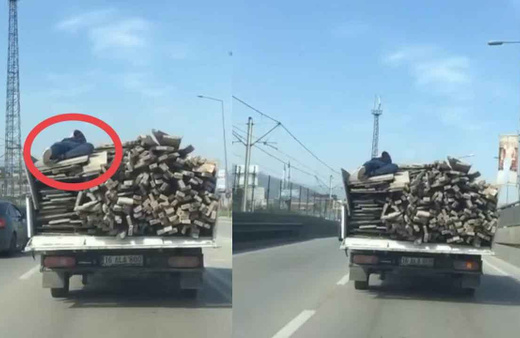 Bursa'da şoke eden görüntü! Canını hiçe saydı, odunların üstüne uzanarak böyle gitti