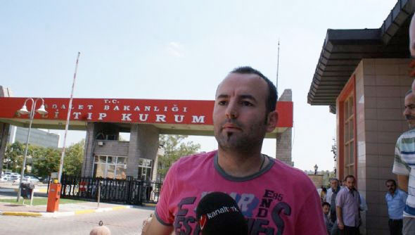 Bebeğinin cesedini koliyle aldı - Resim: 1