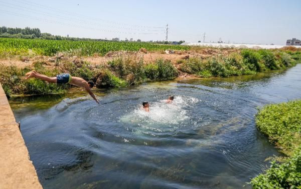 Antalya'da sıcaktan bunalanlar denizde ve kanallarda yüzdü - Resim: 3