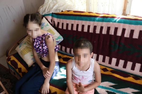 İzmir'de üvey baba vahşeti iki kardeşe keser sapıyla işkence etti tutuklandı - Resim: 1