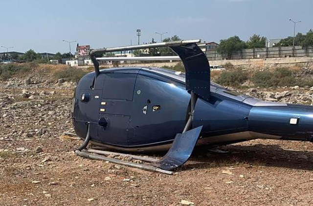 İzmir'de helikopter kazası! Helikopter kalkıştan kısa süre sonra boş araziye acil iniş yaparken... - Resim: 2