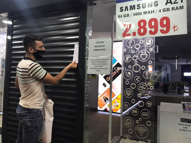 Manisa Ülkü Ocakları sabah namazı sonrası esnafı kapı kapı gezip zarf içinde para bıraktı - Resim: 0