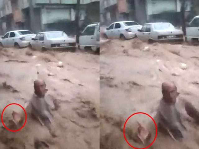 Tepki çeken görüntüler: Sele kapılan adam elini uzattı, tutmak yerine video çekti! - Resim: 0